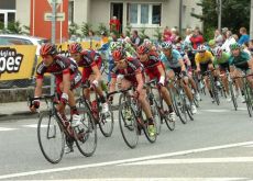 Cadel Evans and his BMC teammates lead the peloton tailed by Team Sky's Bradley Wiggins and Thomas Voeckler of Europcar. Photo Fotoreporter Sirotti.