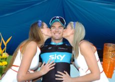 Chris Sutton (Team Sky) gets a treat from the podium girls. Photo copyright Fotoreporter Sirotti. Chris Sutton (Team Sky) gets a treat from the podium girls. Photo copyright Fotoreporter Sirotti.