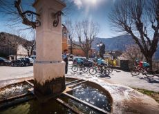 Paris-Nice riders riding past fountain in stage 7