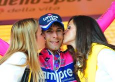 Diego Ulissi gets celebrated by the podium girls.