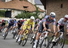 Jasper Philipsen in the yellow jersey in the peloton