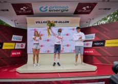 Mattias Skjelmose on the Tour de Suisse podium with podium girl