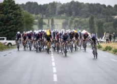 | A.S.O. The Tour de France peloton in the rain
