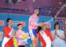 Pieter Weening celebrates his continued Giro lead on the podium. Photo Fotoreporter Sirotti. Pieter Weening celebrates his continued Giro lead on the podium. Photo Fotoreporter Sirotti.