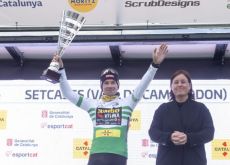 Race leader Primoz Roglic wearing the race leader jersey on the podium