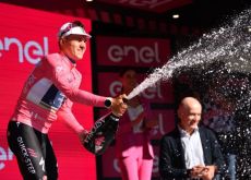 Remco Evenepoel celebrates his stage 1 victory on the Giro d'Italia podium