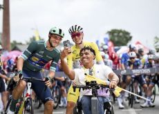 | A.S.O. Tadej Pogacar and Jonathan Milan with a disabled person in wheelchair