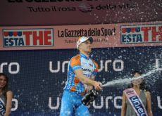 Tyler Farrar celebrates his win on the podium. Photo copyright Fotoreporter Sirotti.