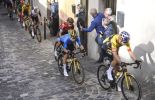 Favorites climb the cobbled streets in Osimo on their bikes