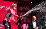 Remco Evenepoel celebrates his stage 1 victory on the Giro d'Italia podium