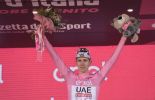 Tadej Pogacar on the podium in the pink jersey as leader of Giro d'Italia 2024