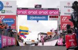 Tadej Pogacar crosses the finish line as winner of stage 15 of Giro d'Italia 2024 in Livigno